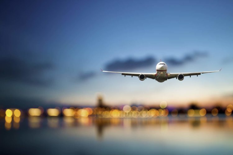 perspective view of jet airliner in flight with bokeh background