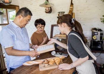 Small bakery business buying customer