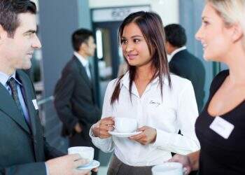 businesspeople interacting during coffee break at business conference