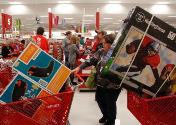 Darlene Gober leaves a Dallas area Target store at 10 p.m. with two cartfuls of items after saving big on Black Friday deals on Thursday night November 22, 2012. (Richard W. Rodriguez/ AP Images for Target)