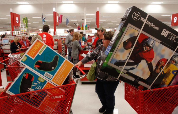 Darlene Gober leaves a Dallas area Target store at 10 p.m. with two cartfuls of items after saving big on Black Friday deals on Thursday night November 22, 2012. (Richard W. Rodriguez/ AP Images for Target)