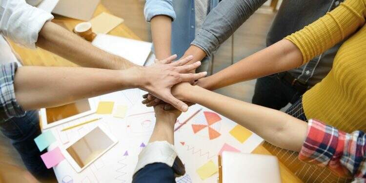 Hands of group of businesspersons showing teamwork