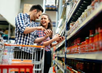 Couple shopping at supermarket together